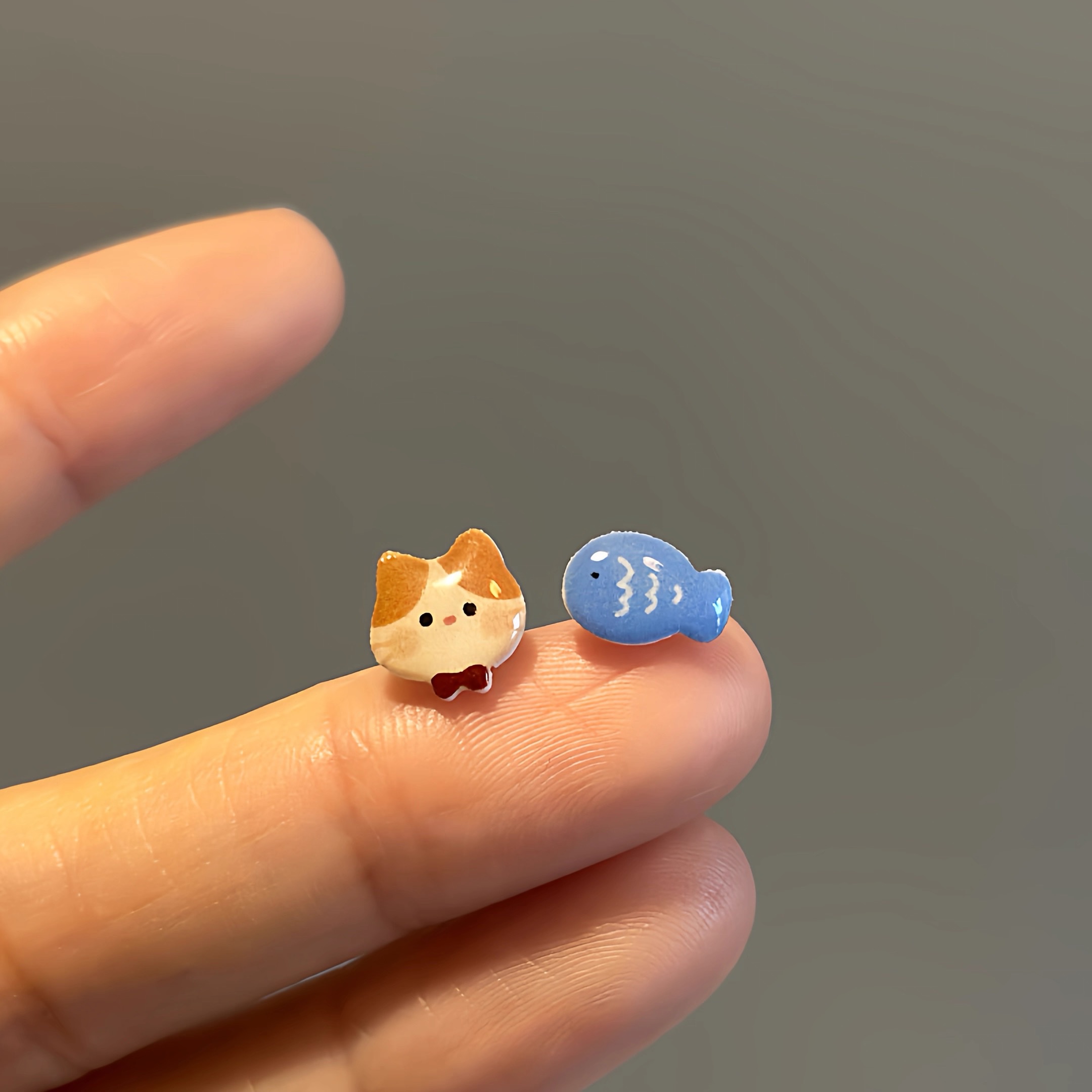 The 2026 new style of ear studs for women is cute and small, featuring cat and fish earrings. It is made of pure silver, with asymmetrical ear studs and no ear holes detail image 2