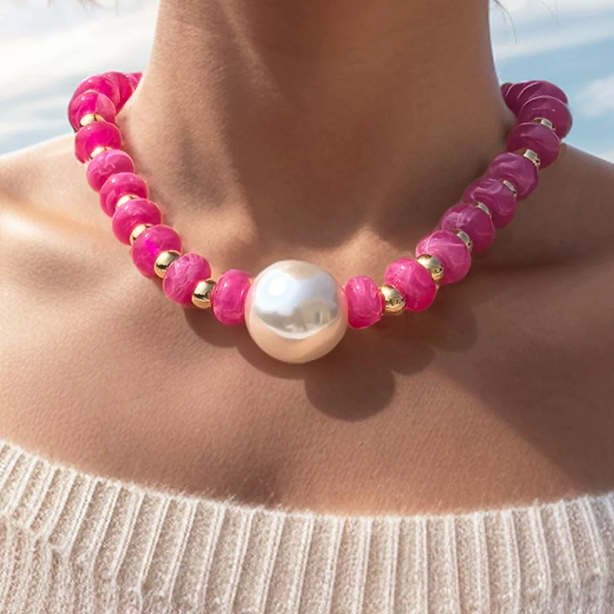 This is a cross-border best-selling pearl necklace with hand-strung colored resin beads. It features an exaggerated Bohemian vacation style ABS exaggerated pearl necklace Application Scenario