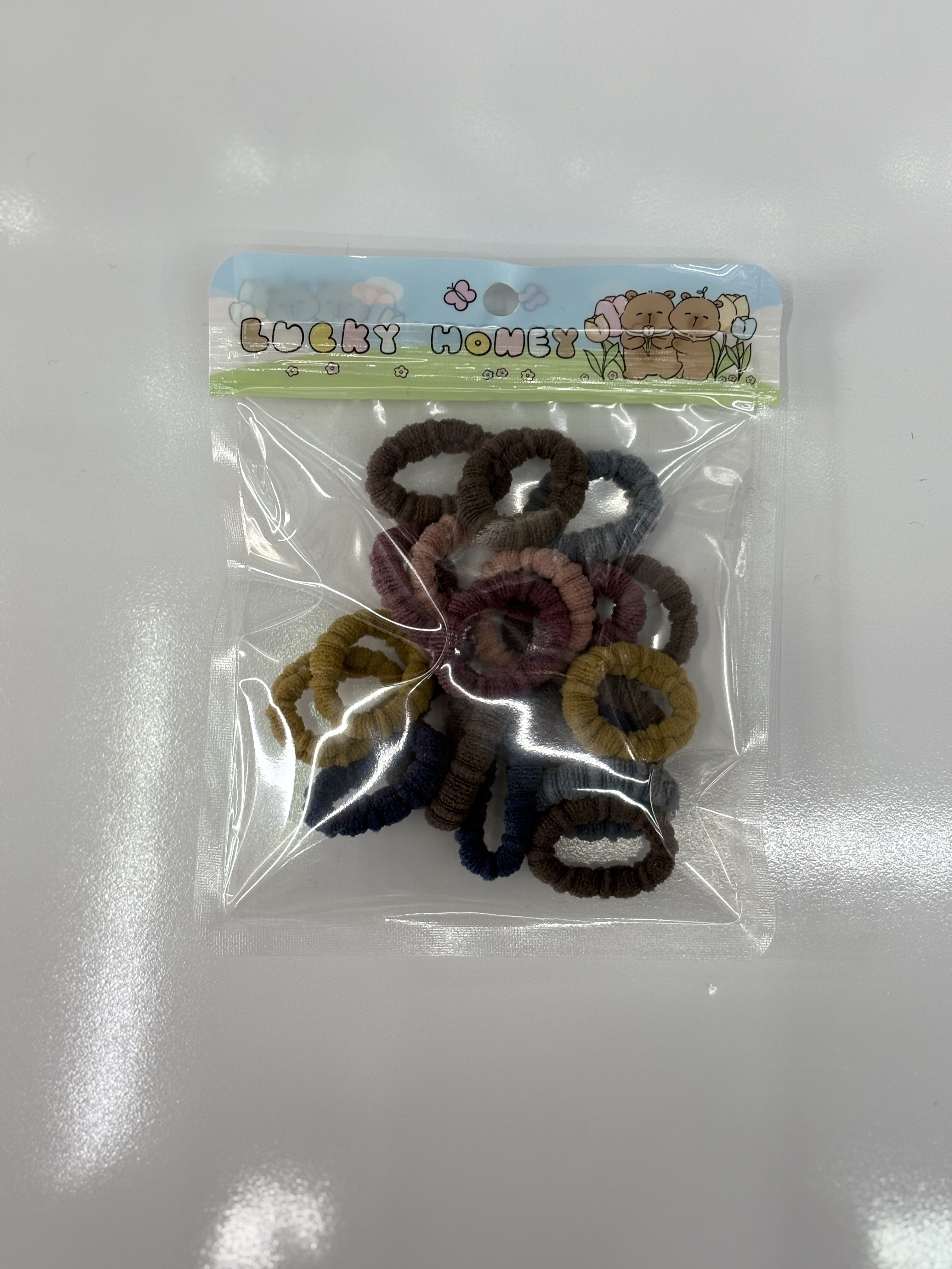 New cartoon creative hand-held bag children's towel ring hair accessory, 25 pieces of high-elasticity towel ring hair tie details Picture