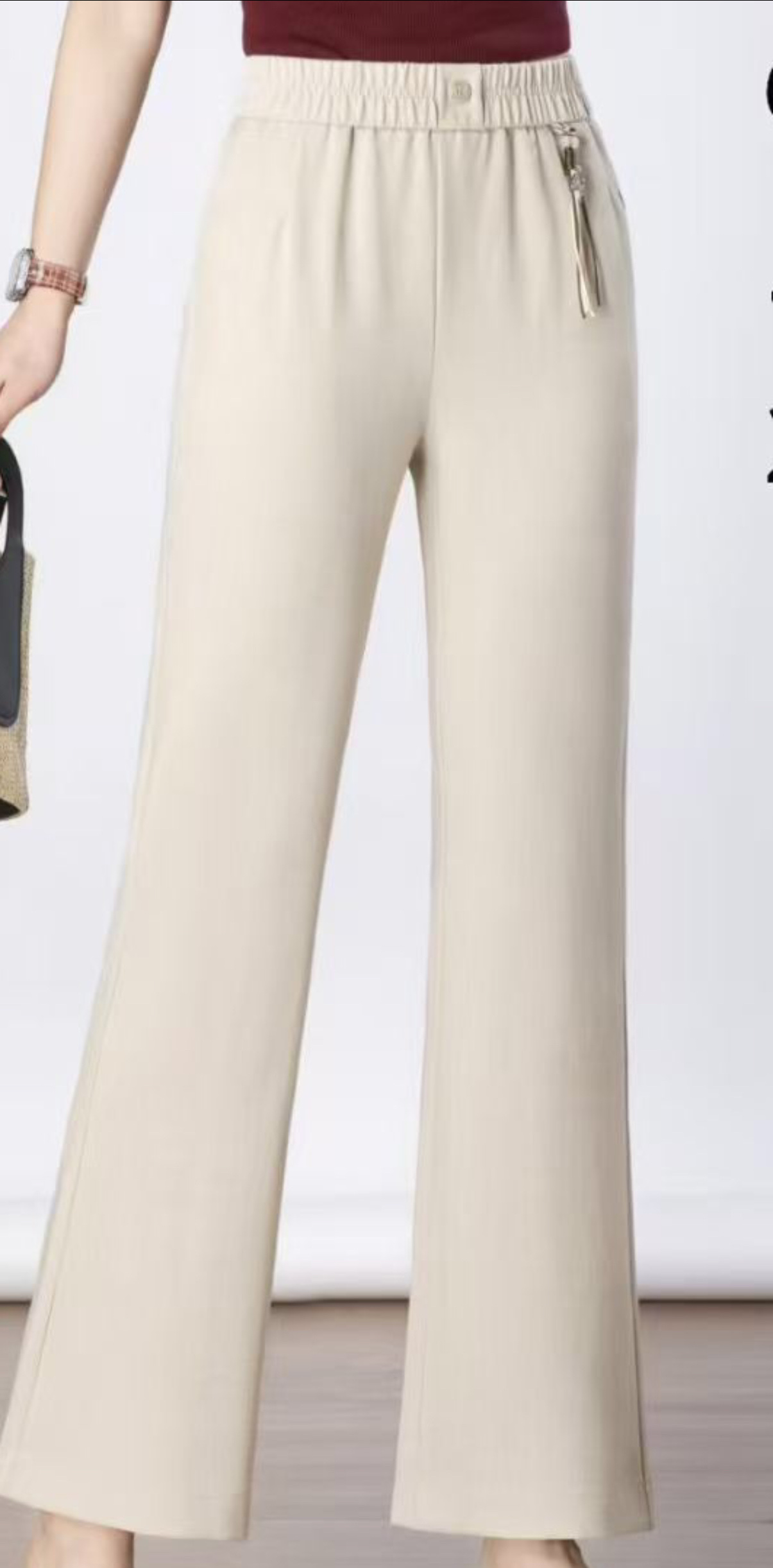 The trendy women's trousers for Spring and Autumn 2026 are flared flared pants with elastic waists and beige long pants details Picture