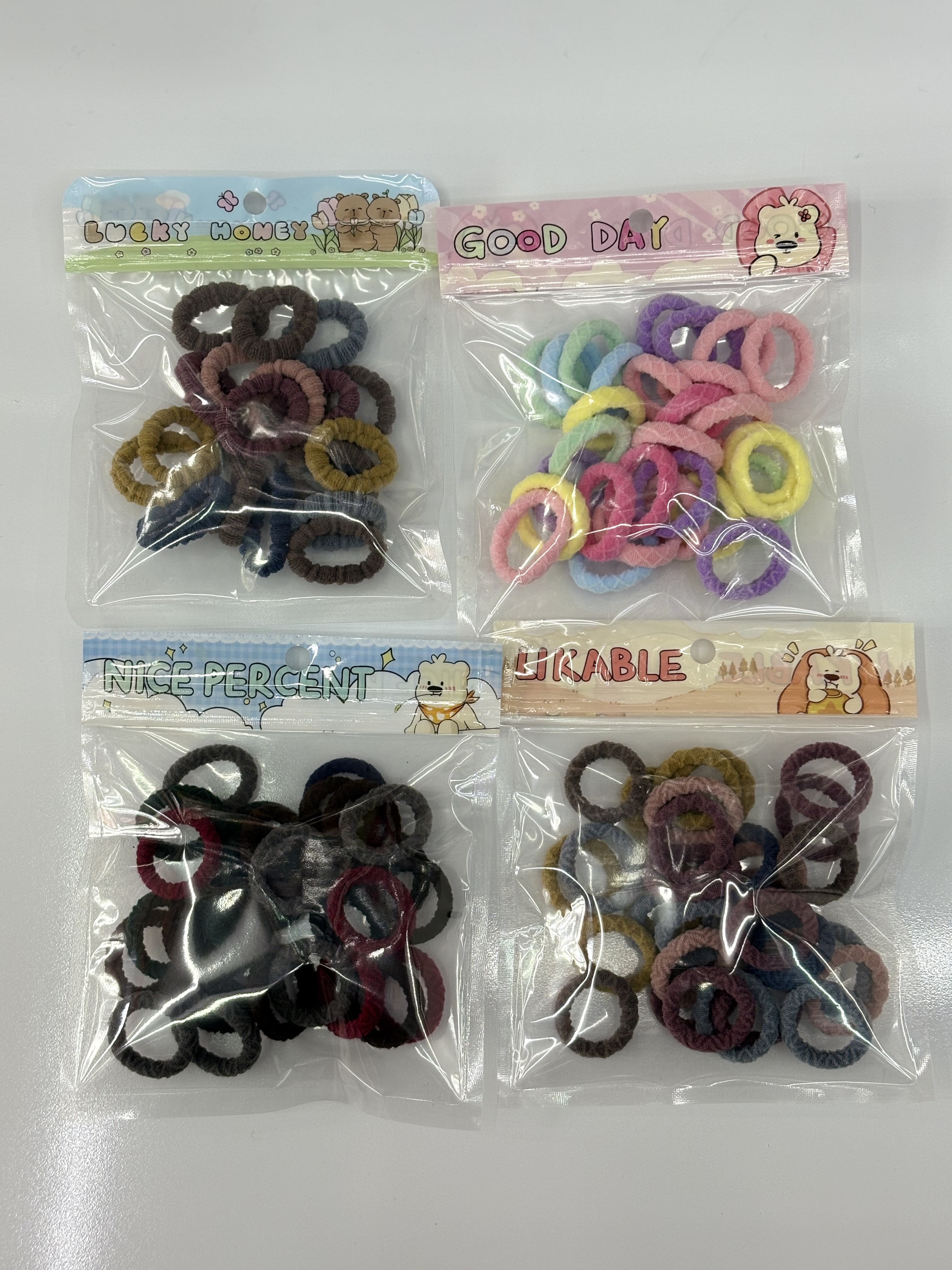 New cartoon creative hand-held bag children's towel ring hair accessory, 25 pieces of high-elasticity towel ring hair tie Item Picture