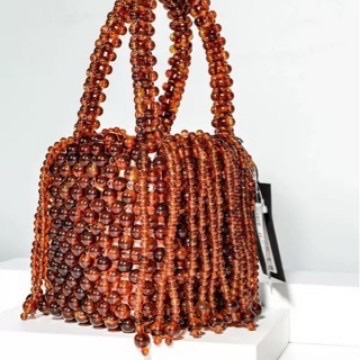 Cross-border wholesale best-selling hand-woven acrylic bead dynamic tassel handbag, niche design banquet bag details Picture