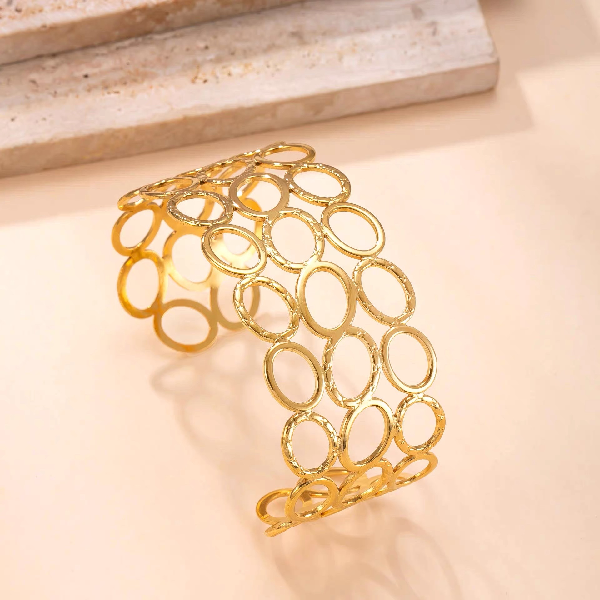 New stainless steel bracelet, oil-pressed hollowed-out round opening bracelet, fashionable and niche design titanium steel