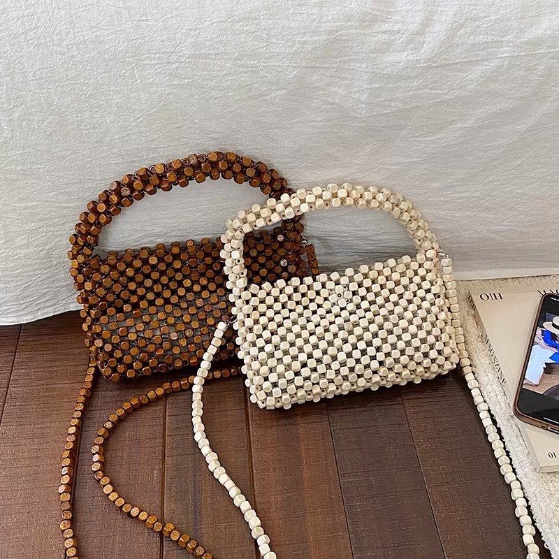 A new retro creative woven hand-held beaded women's bag with a strong sense of handcrafting and high-end chain single-shoulder crossbody bag