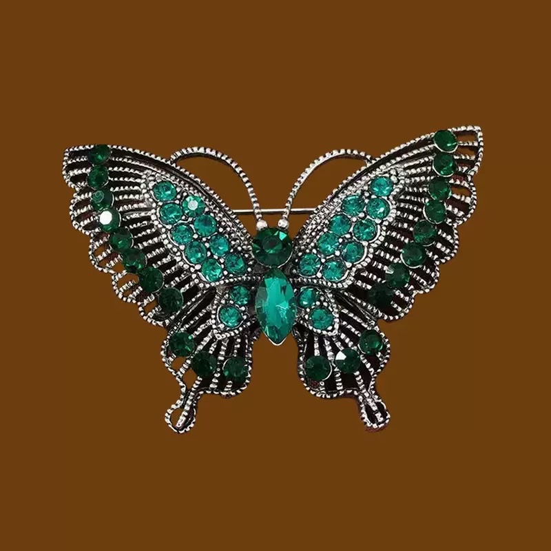 European and American fashion, individual, retro alloy, diamond-encrusted crystal, hollowed-out butterfly brooch women's clothing accessories Application Scenario