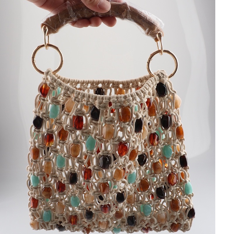 This high-end silver hand-beaded, shiny woven handbag features a niche design and is fashionable. It is a single-shoulder, underarm commuter bag for women detail image 6