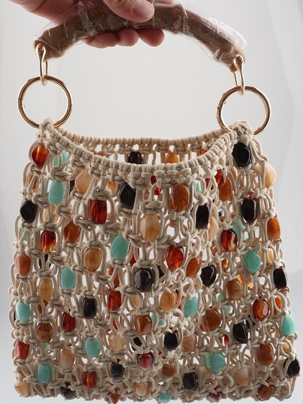 This high-end silver hand-beaded, shiny woven handbag features a niche design and is fashionable. It is a single-shoulder, underarm commuter bag for women Item Picture