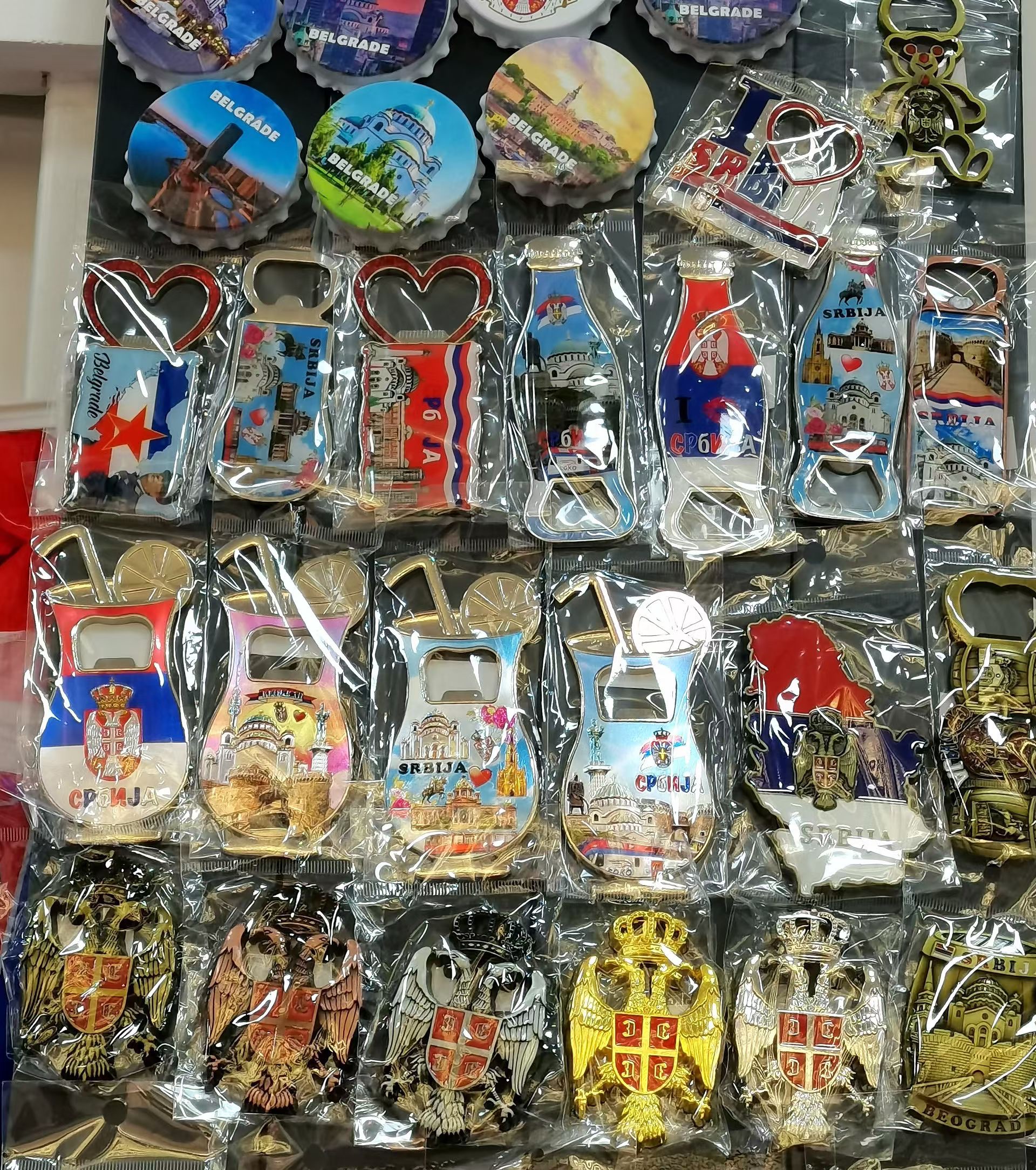 Tourist souvenirs, fridge magnets, bottle openers and gifts full figure