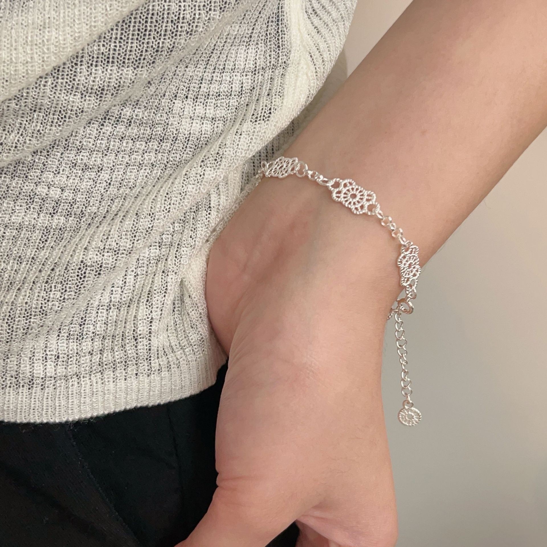 The S925 sterling silver geometric hollowed-out lace bracelet is a rare, light luxury, sweet and elegant accessory for women, with a high-end feel and versatility Item Picture