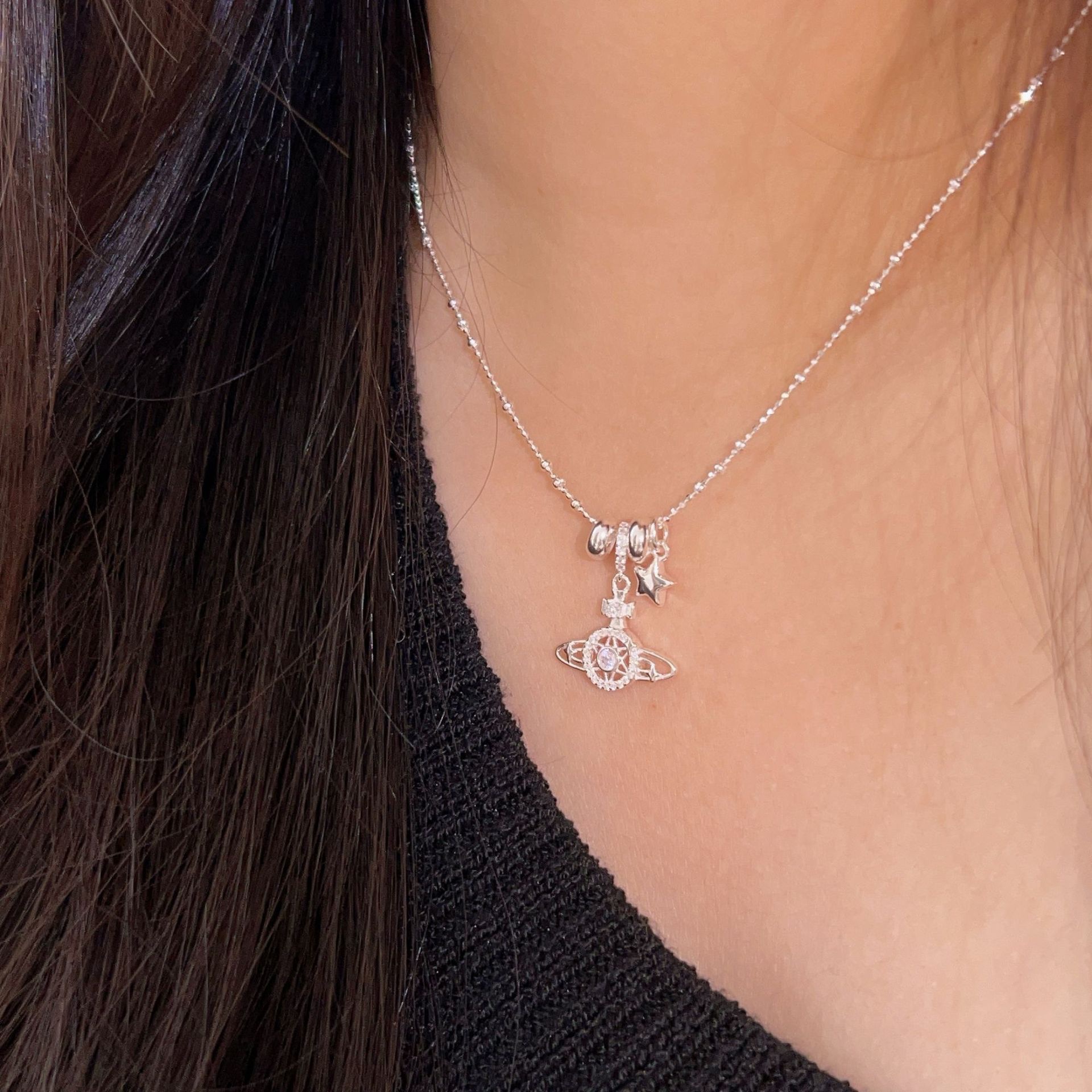 The Korean version of the S925 sterling silver Saturn necklace is a niche and fashionable design for women, with a high-end feel. It is a versatile collarbone chain details Picture