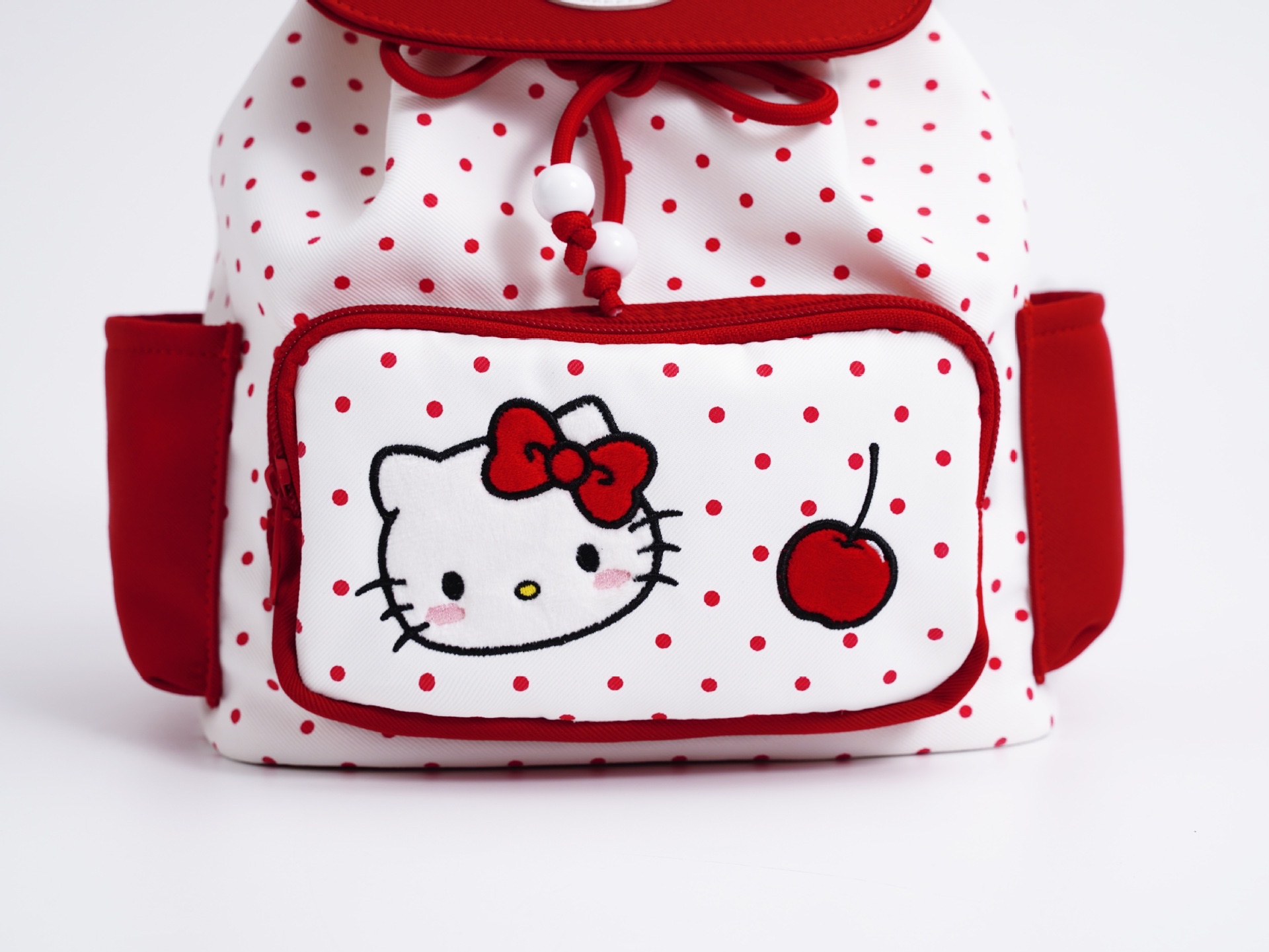 Red polka dot Hello kitty cartoon backpack Flip-top drawstring backpack for outdoor use Application Scenario