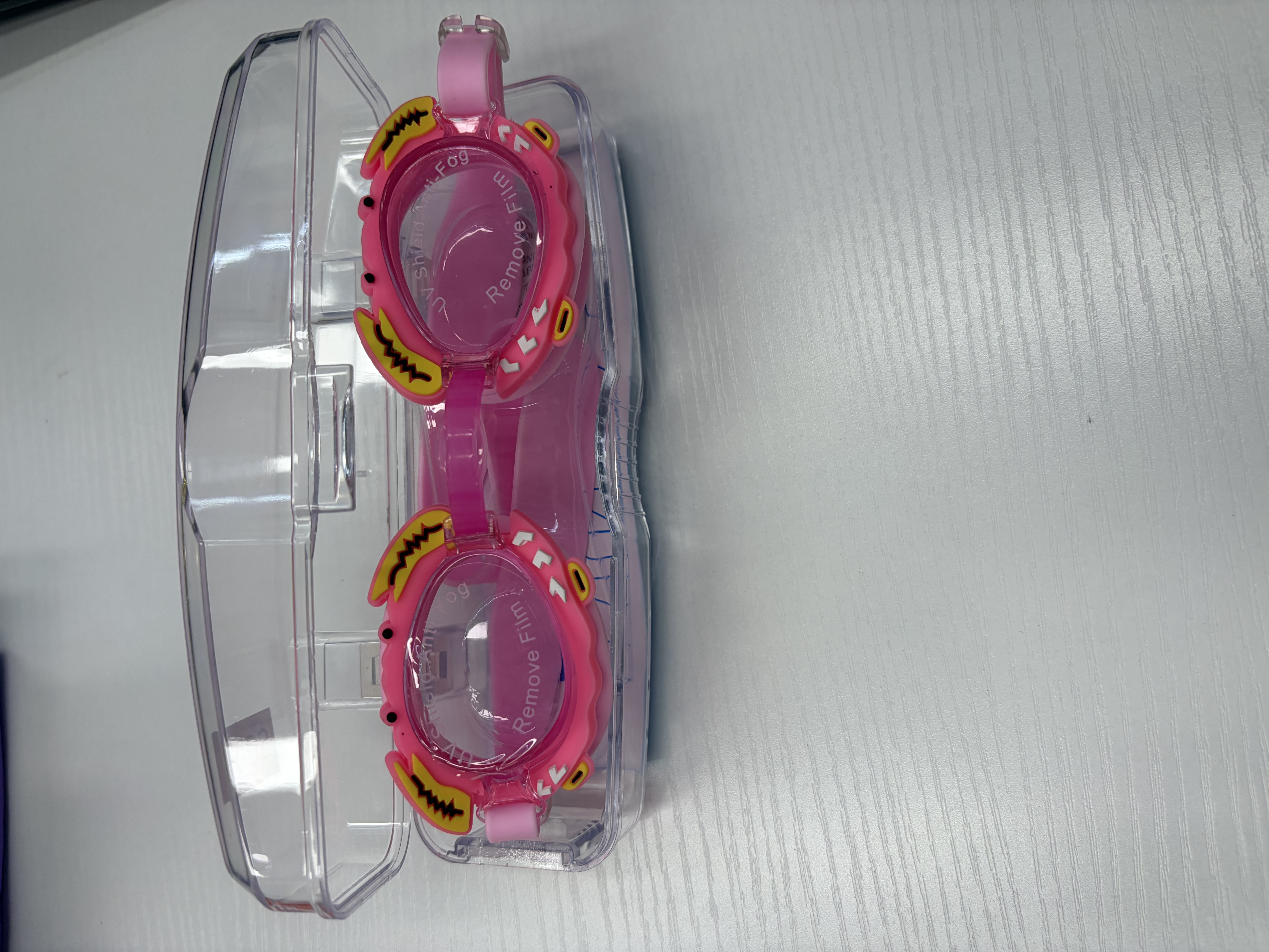 Pink children's swimming goggles with transparent storage boxes detail image 1