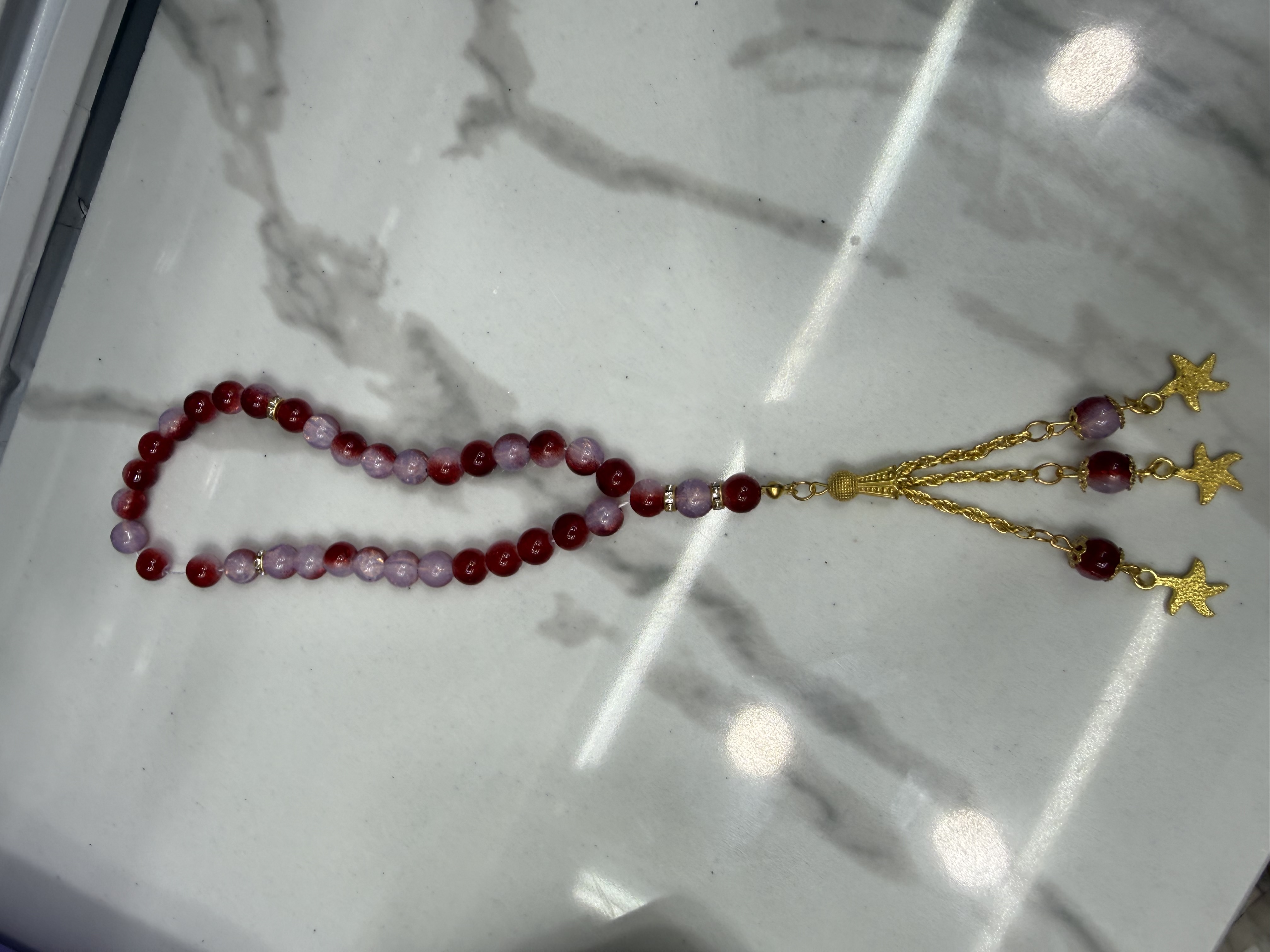 33 lacquered glass Muslim prayer beads, alloy whisk tips, 50 dozen per piece, 12 in a dozen. The price is for individual pieces