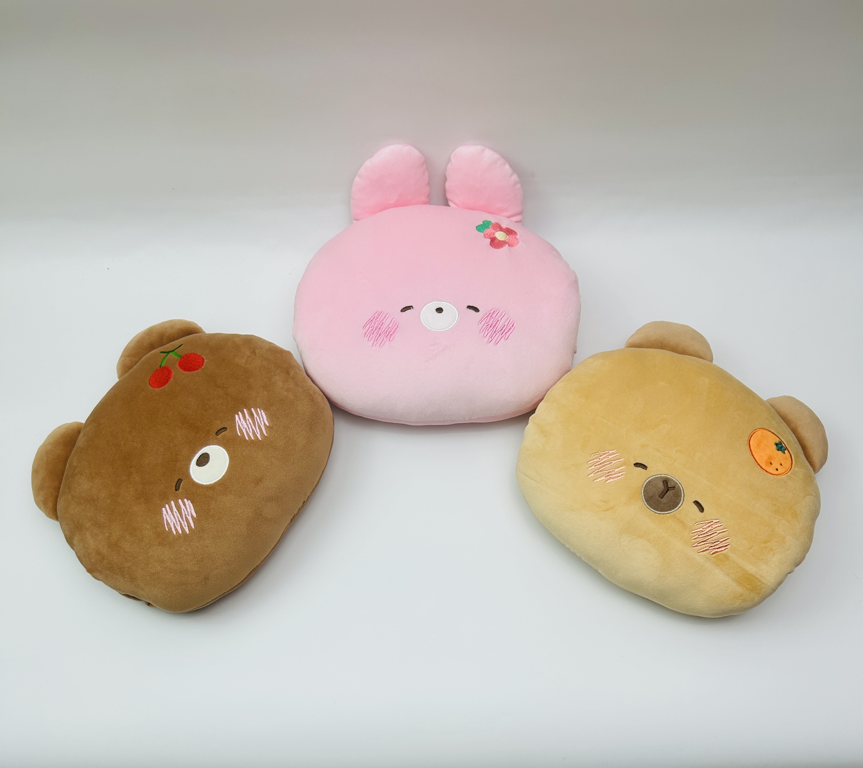 Cartoon fruit bear rabbit plush hand cover, winter hand warming throw pillow, claw machine doll gift supply Application Scenario
