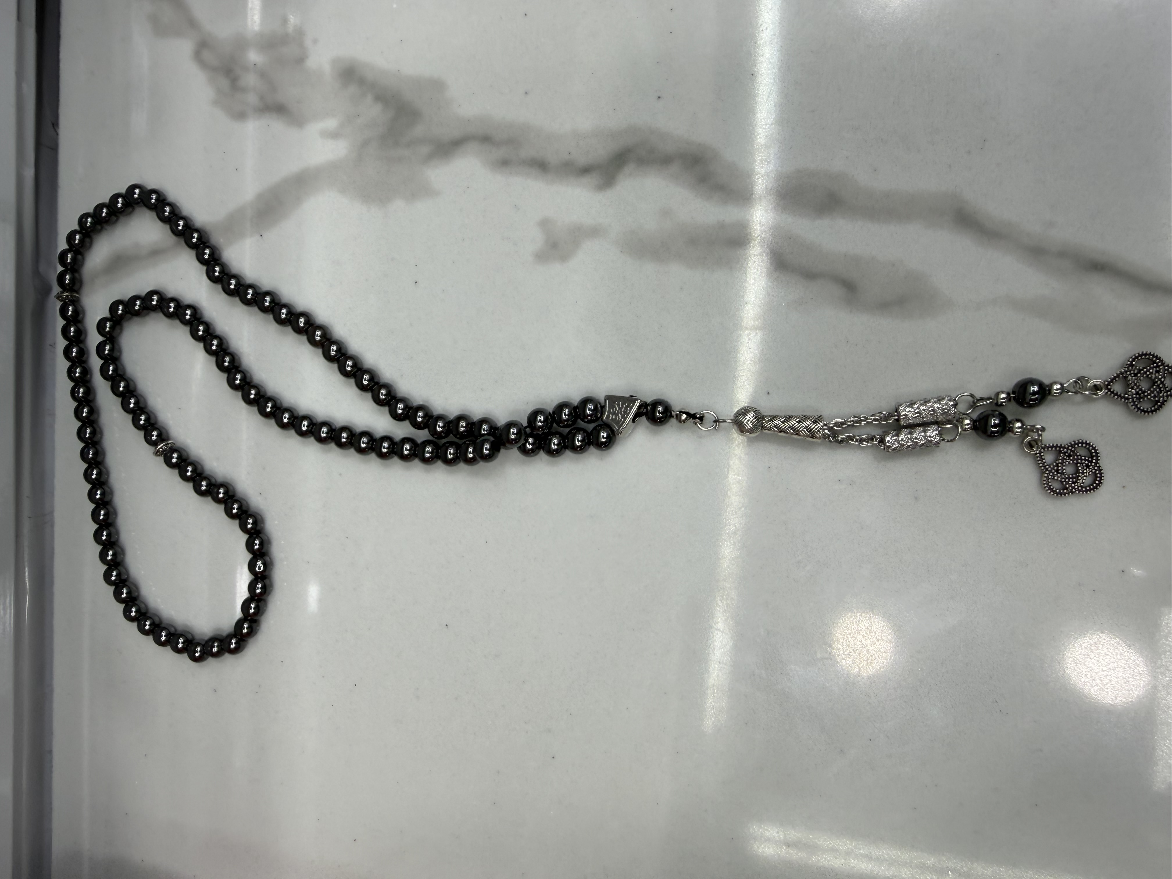 Muslim 99 black gallstone prayer beads, No. 6, alloy whisker tips, 12 in a dozen, 30 dozen per piece. The price is for individual pieces details Picture
