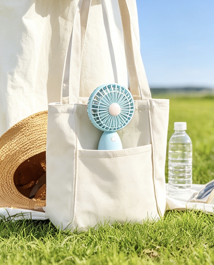Desktop fan, compact handheld, dual-purpose for standing and holding, quiet and low-noise, USB portable charging, five-blade small fan Application Scenario