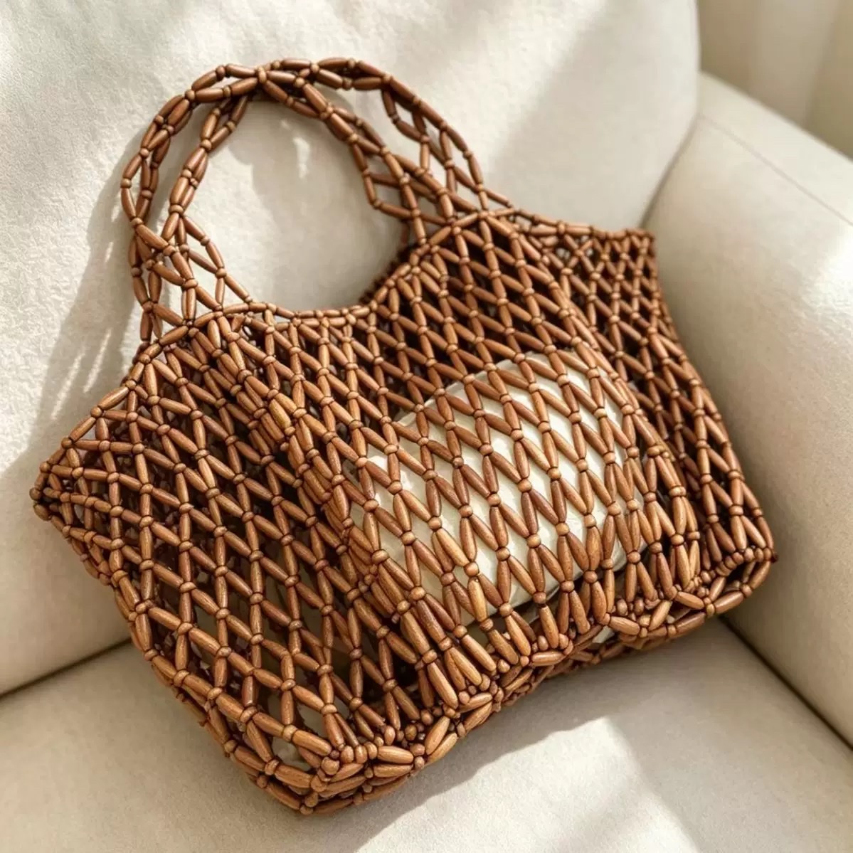 A new large-capacity French hollowed-out hand-woven bag for women, a casual wooden bead hand-held shoulder beach vacation bag detail image 3