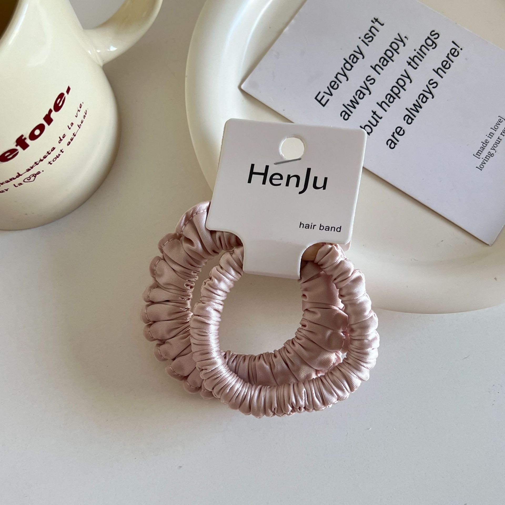 The satin pleated round bead hair band is soft and won't damage the hair. It features a hair tie, a hair accessory, a women's hairpin and a rubber band detail image 4