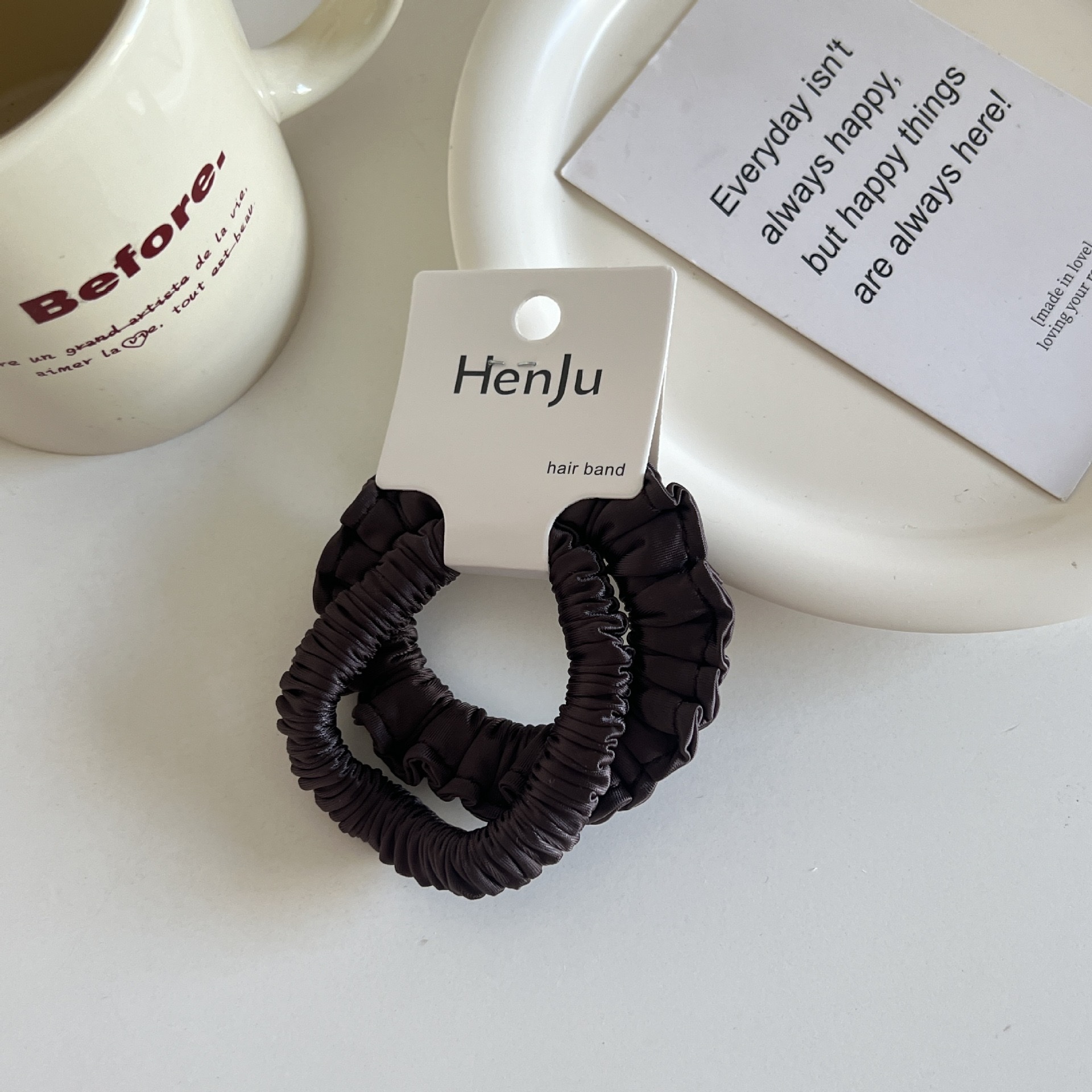 The satin pleated round bead hair band is soft and won't damage the hair. It features a hair tie, a hair accessory, a women's hairpin and a rubber band Item Picture