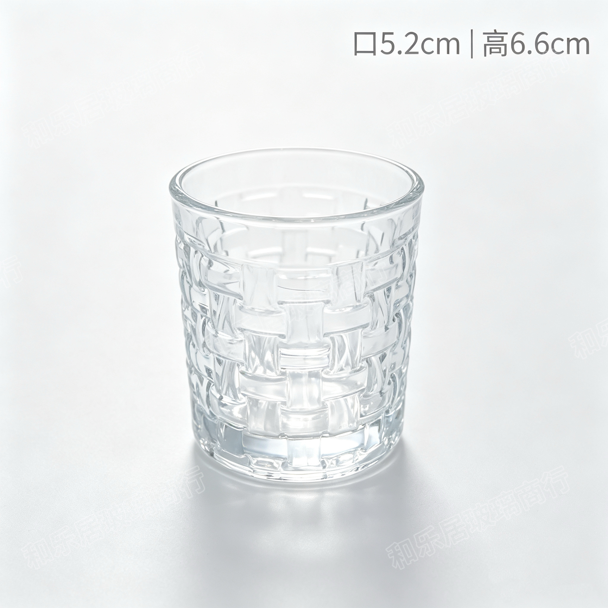 A small transparent glass water cup