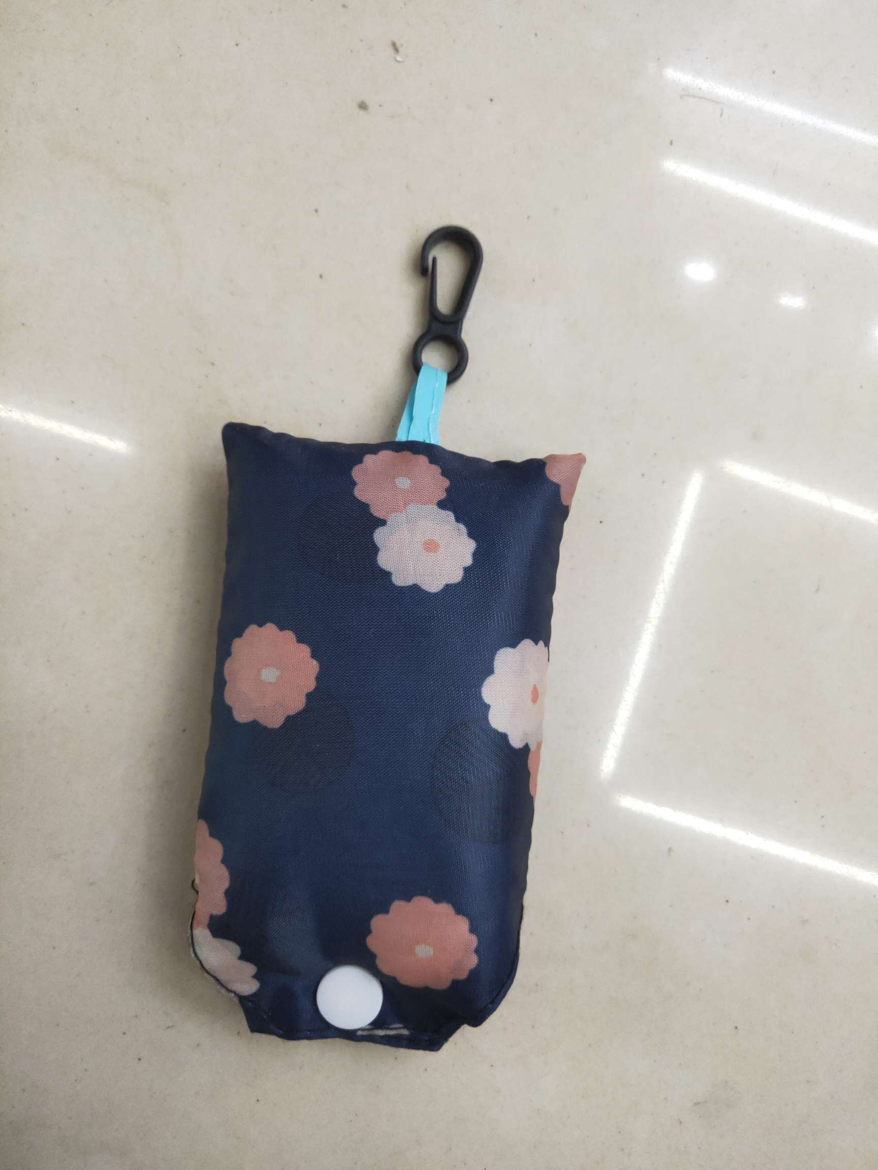 Liby laundry detergent clothing packaging bag, dark blue floral folding storage bag with hook, white snap dust-proof plastic sorting bag full image