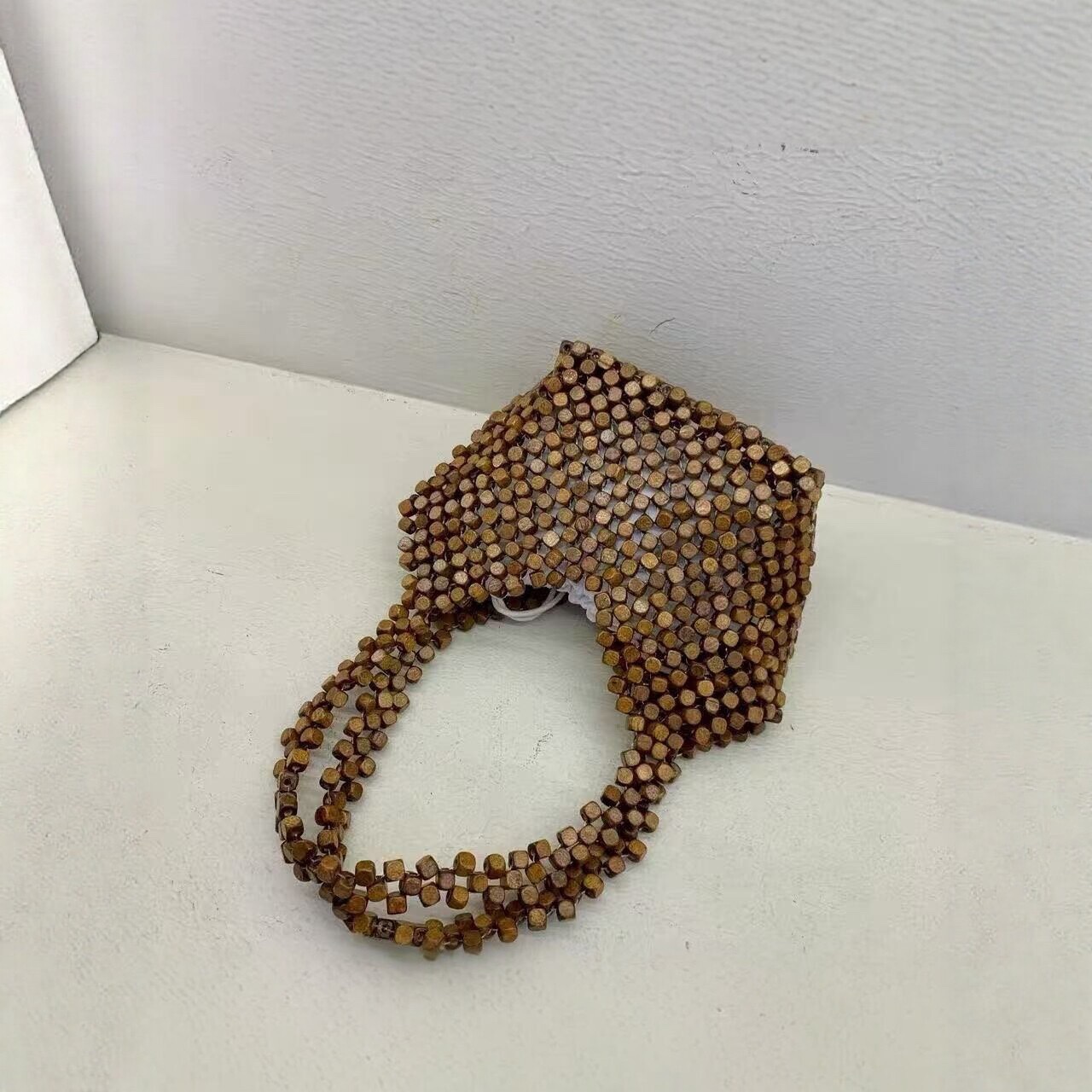 The 2026 new fashion, versatile and niche hand-woven shoulder bag for women, a casual hollowed-out tote bag for women, is a stylish crossbody bag for women detail image 5