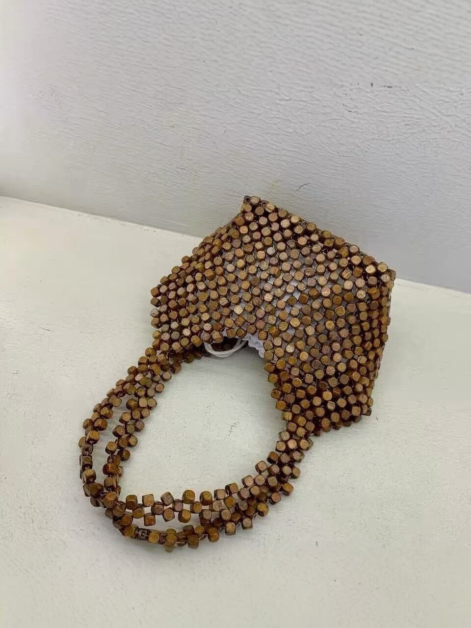 The 2026 new fashion, versatile and niche hand-woven shoulder bag for women, a casual hollowed-out tote bag for women, is a stylish crossbody bag for women
