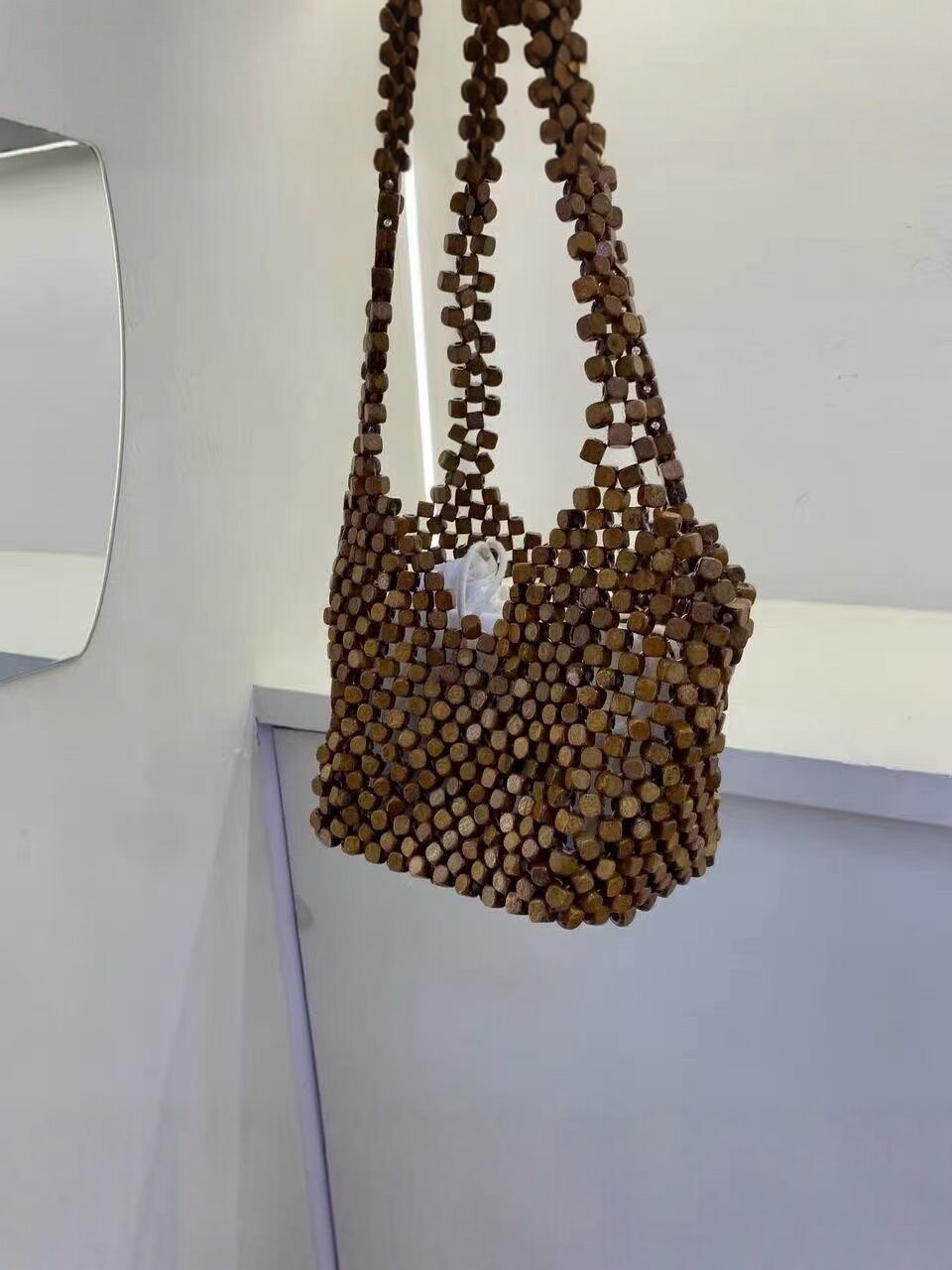 The 2026 new fashion, versatile and niche hand-woven shoulder bag for women, a casual hollowed-out tote bag for women, is a stylish crossbody bag for women detail image 4