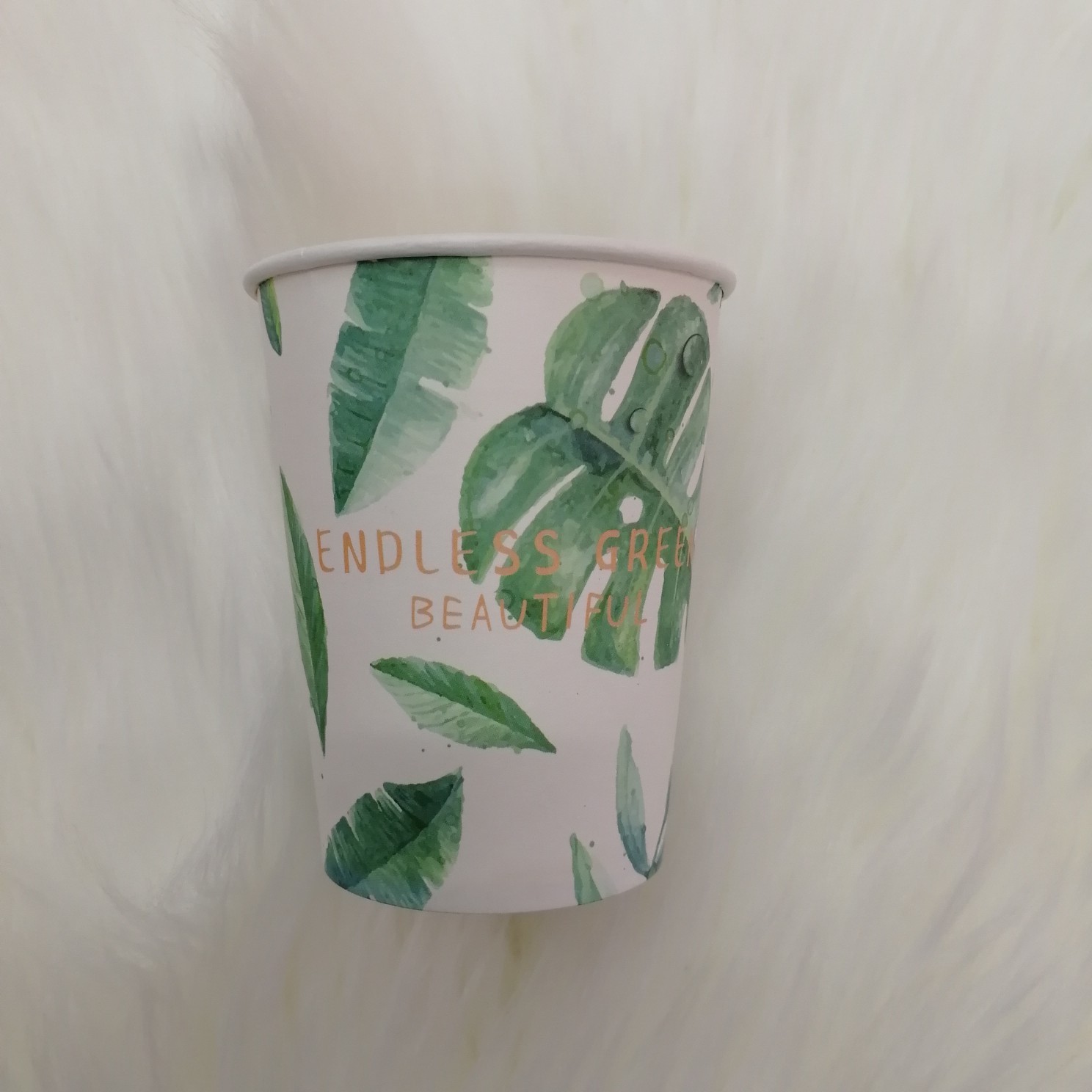 Close-up of 3D water bead texture on green leaf pattern