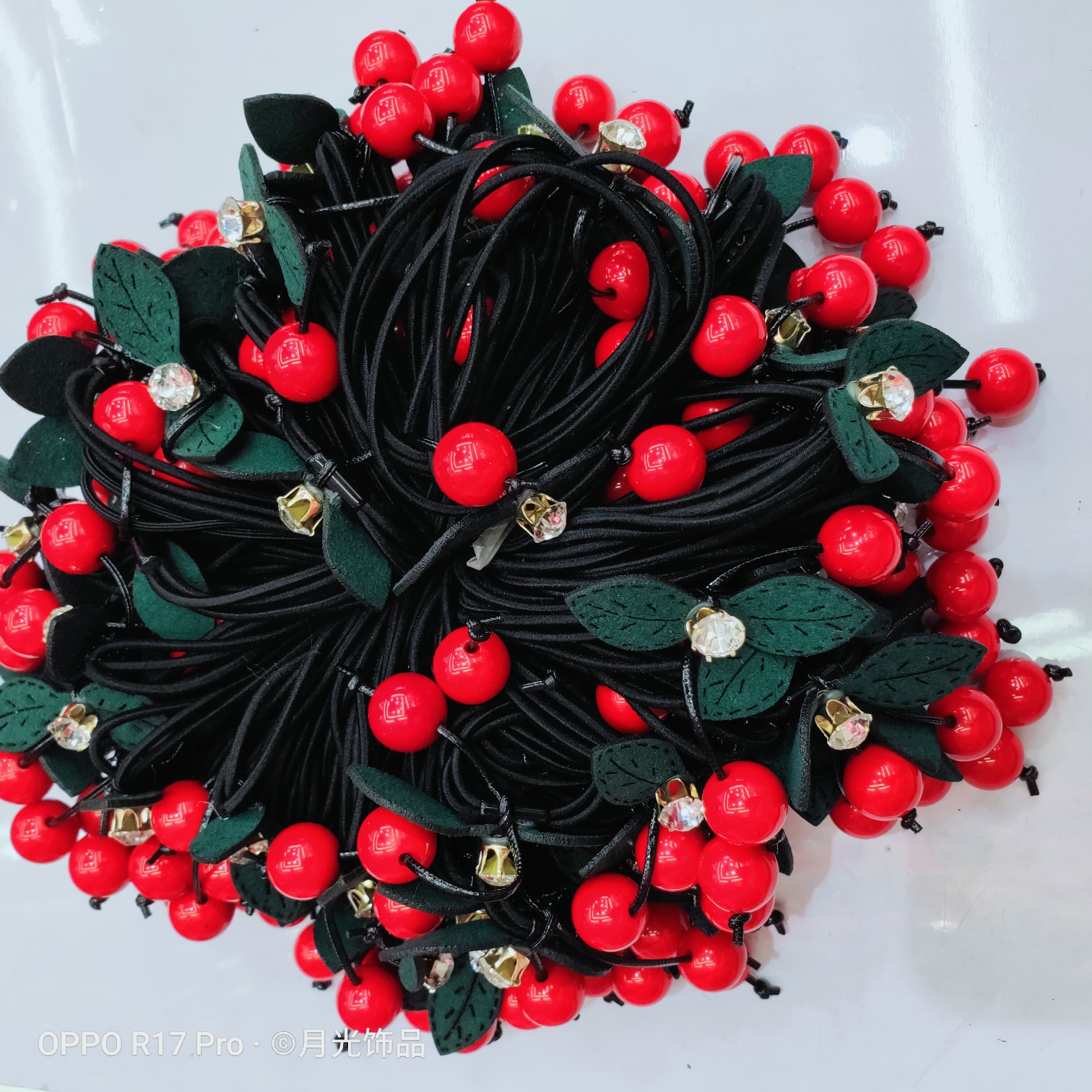 Wholesale of Korean-style trendy red pearl green leaf diamond-encruffed small cherry hair bands, hair ties and leather cases undefined