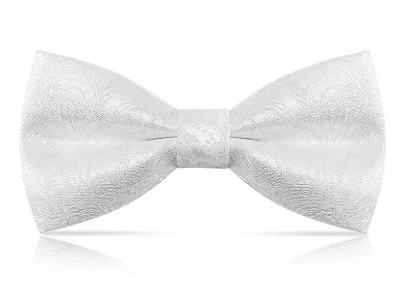 Groom with a bow tie, man in formal attire, best man with a bow tie, British fashion trend, high-end wedding, brothers in suits undefined