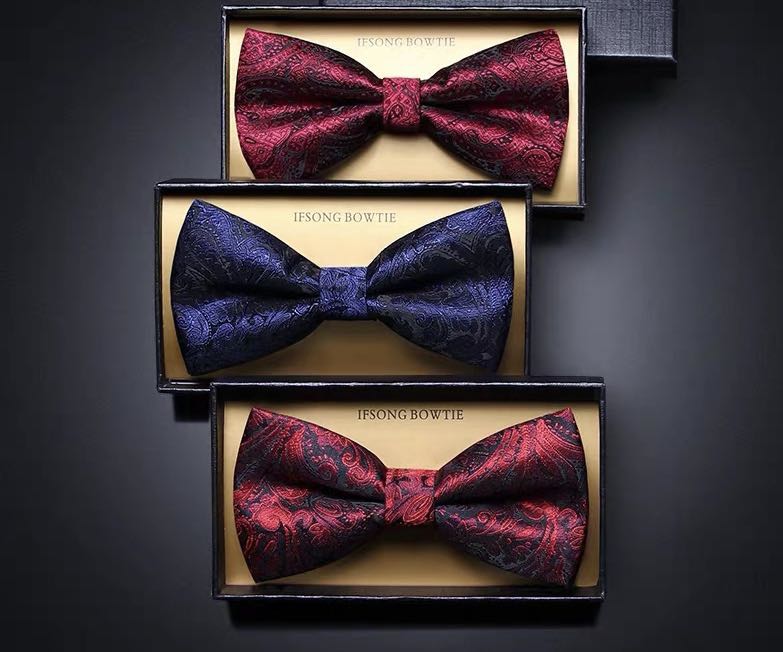 Groom with a bow tie, man in formal attire, best man with a bow tie, British fashion trend, high-end wedding, brothers in suits