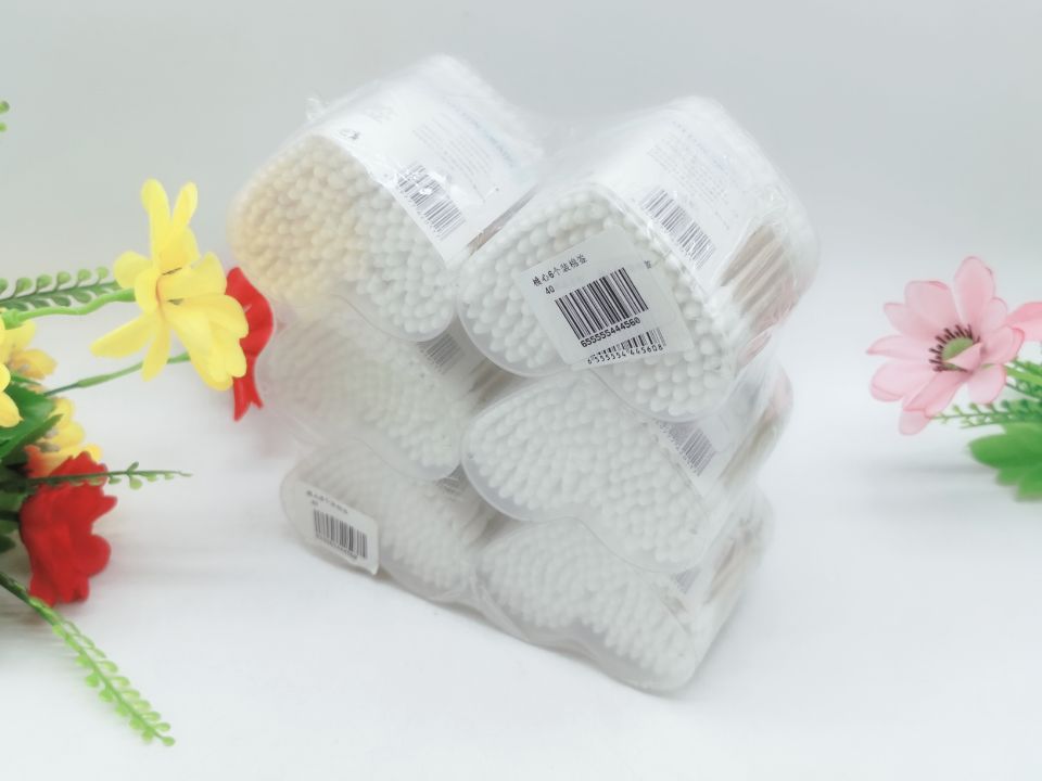 Two large round cotton swabs