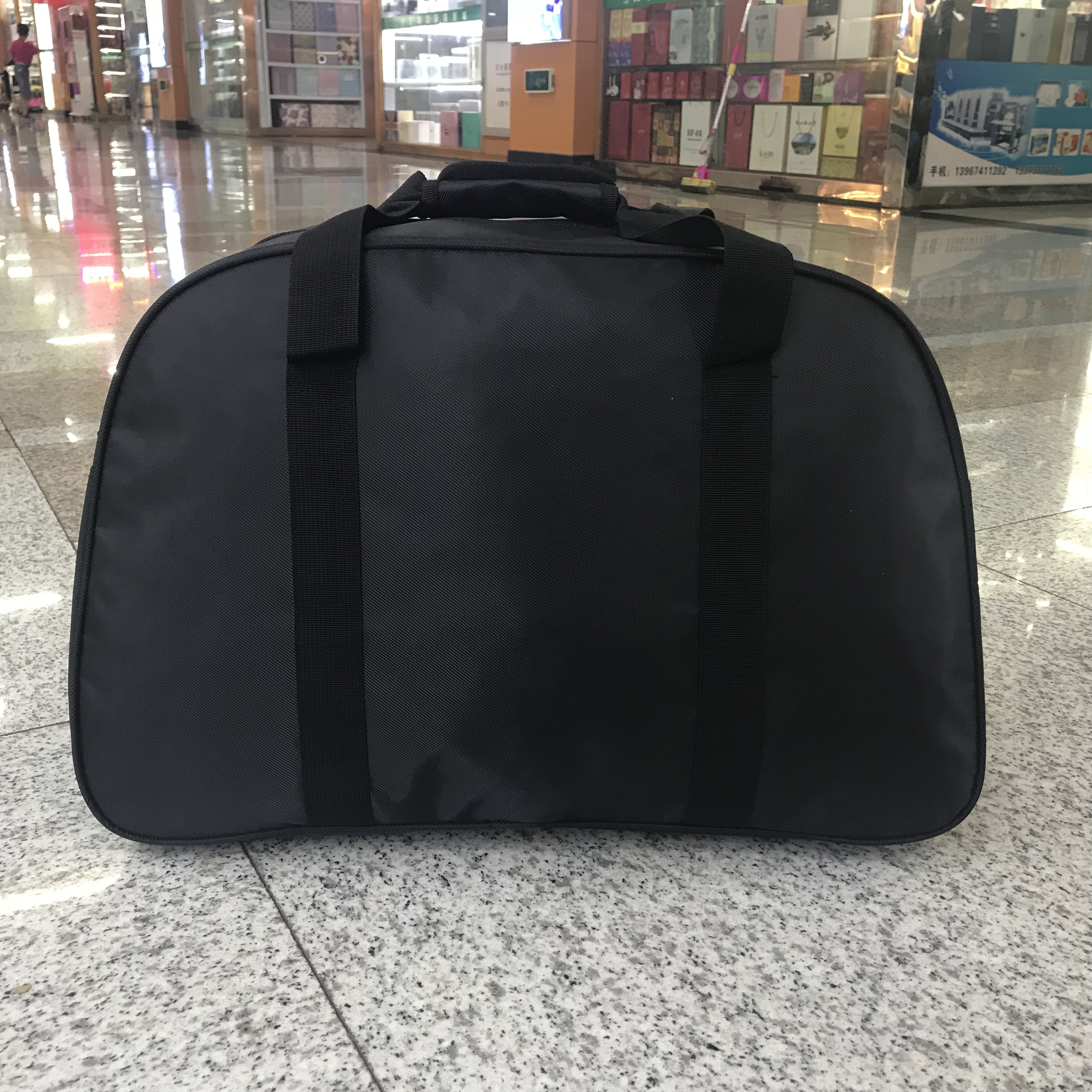 Yiwu quality waterproof nylon hand-held travel bags for business trips and Tours, large-capacity luggage bags for men and women detail image 3