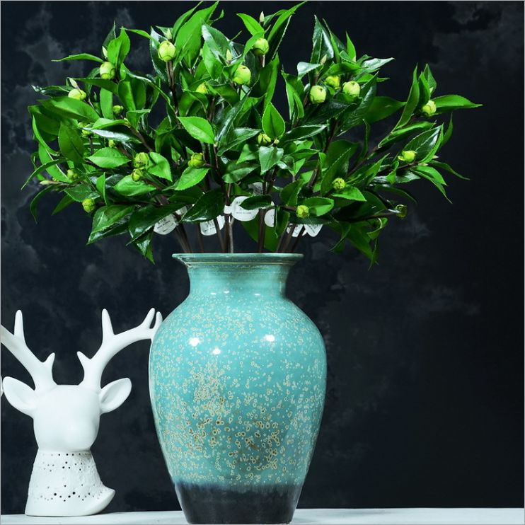 Factory direct simulation wholesale green plant flowers and decoration materials home decoration flowers simulation leaves simulation mountain tea leaves