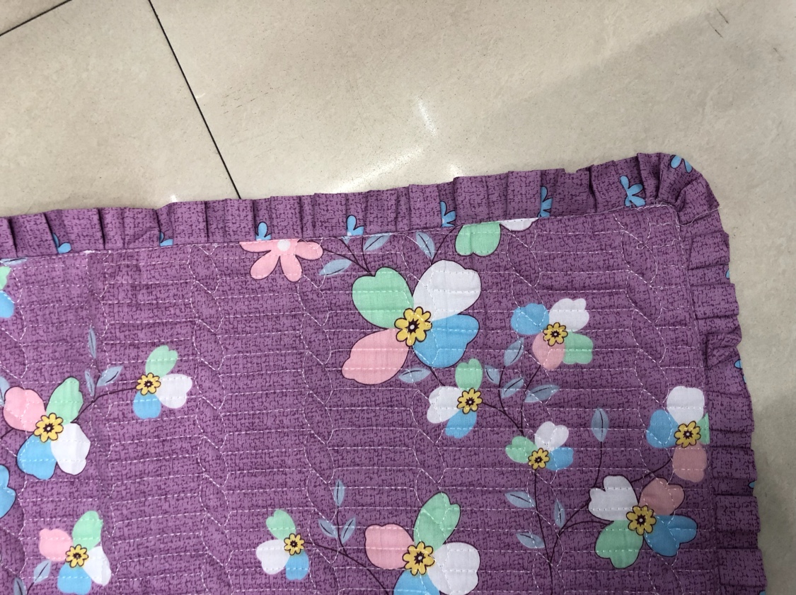 Close-up texture of high-thread-count cotton pillowcase showing fine weave and soft fibers