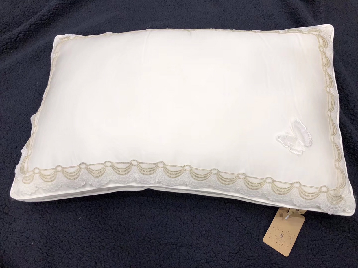 Butterfly-embroidered pillow