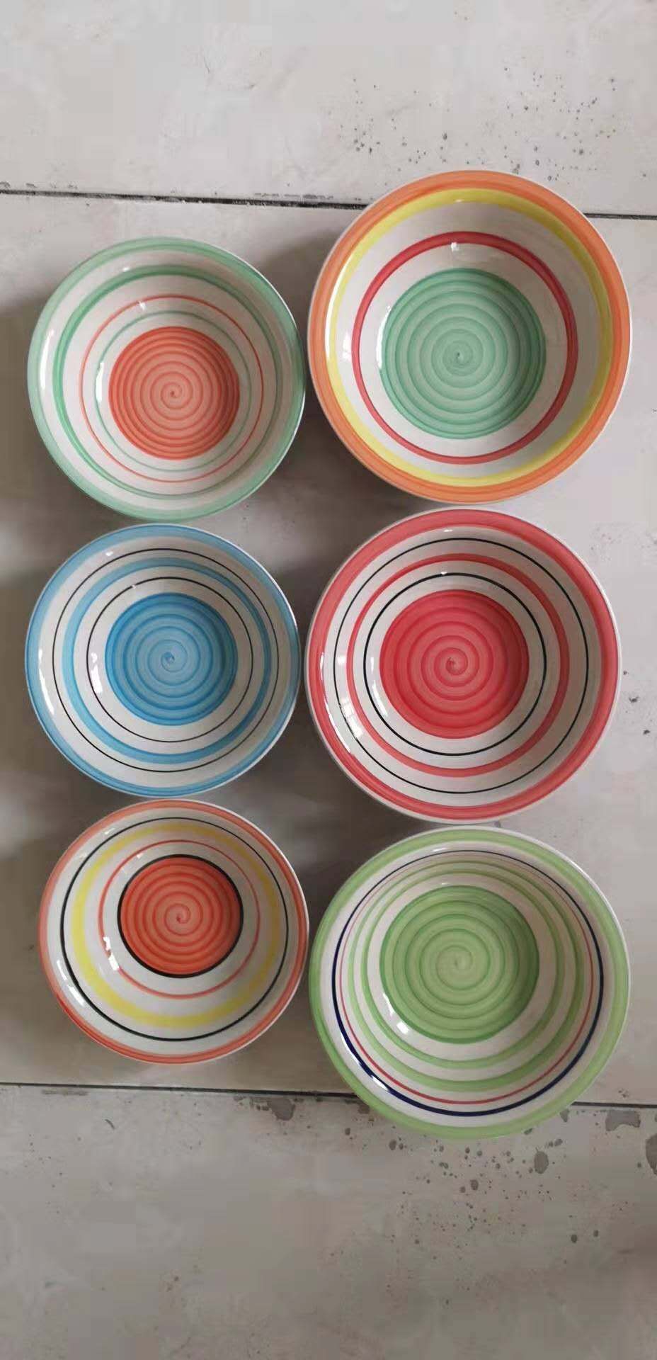 family sitting around dinner scene photo highlights the existence of ceramic tableware