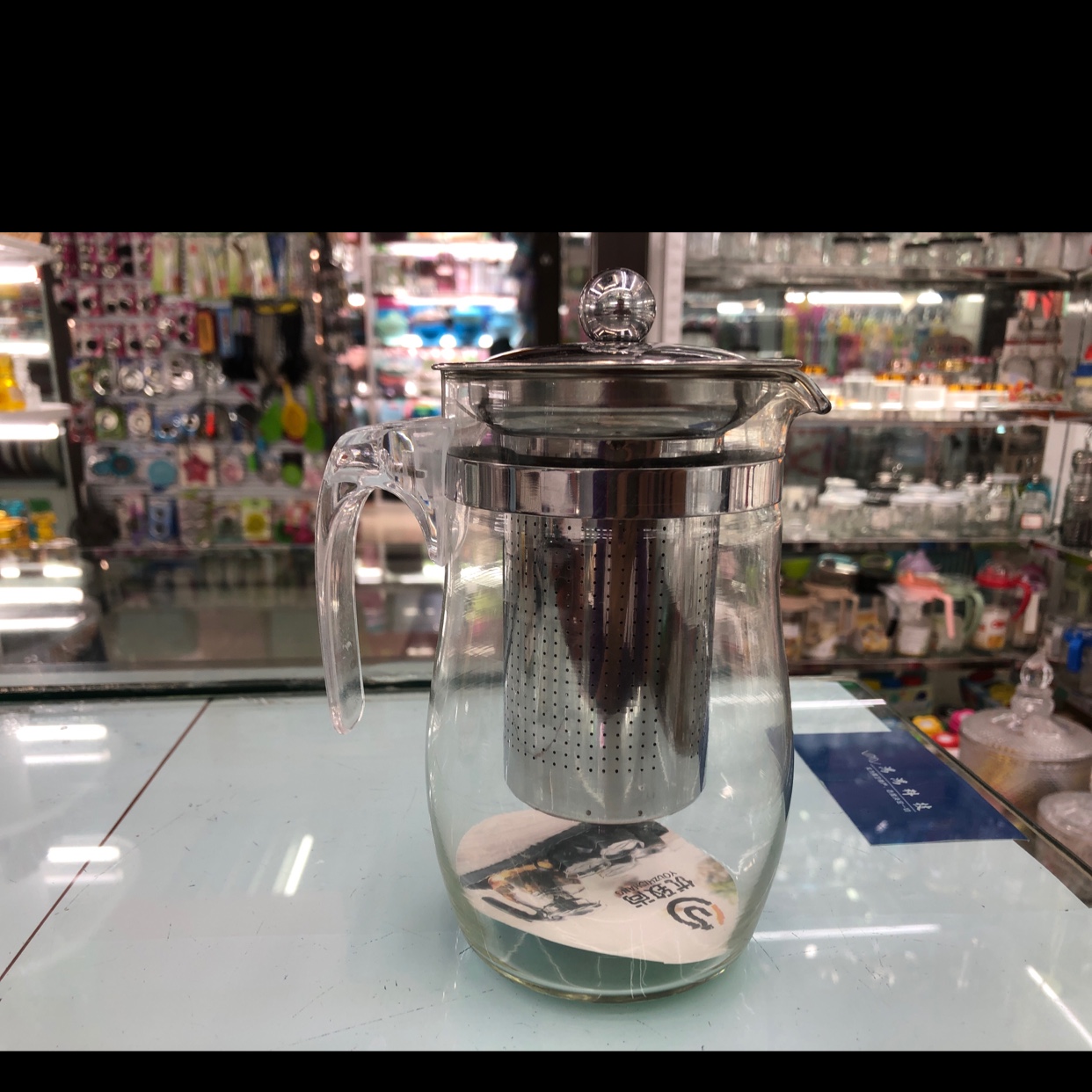 Glass teapot with stainless steel cover