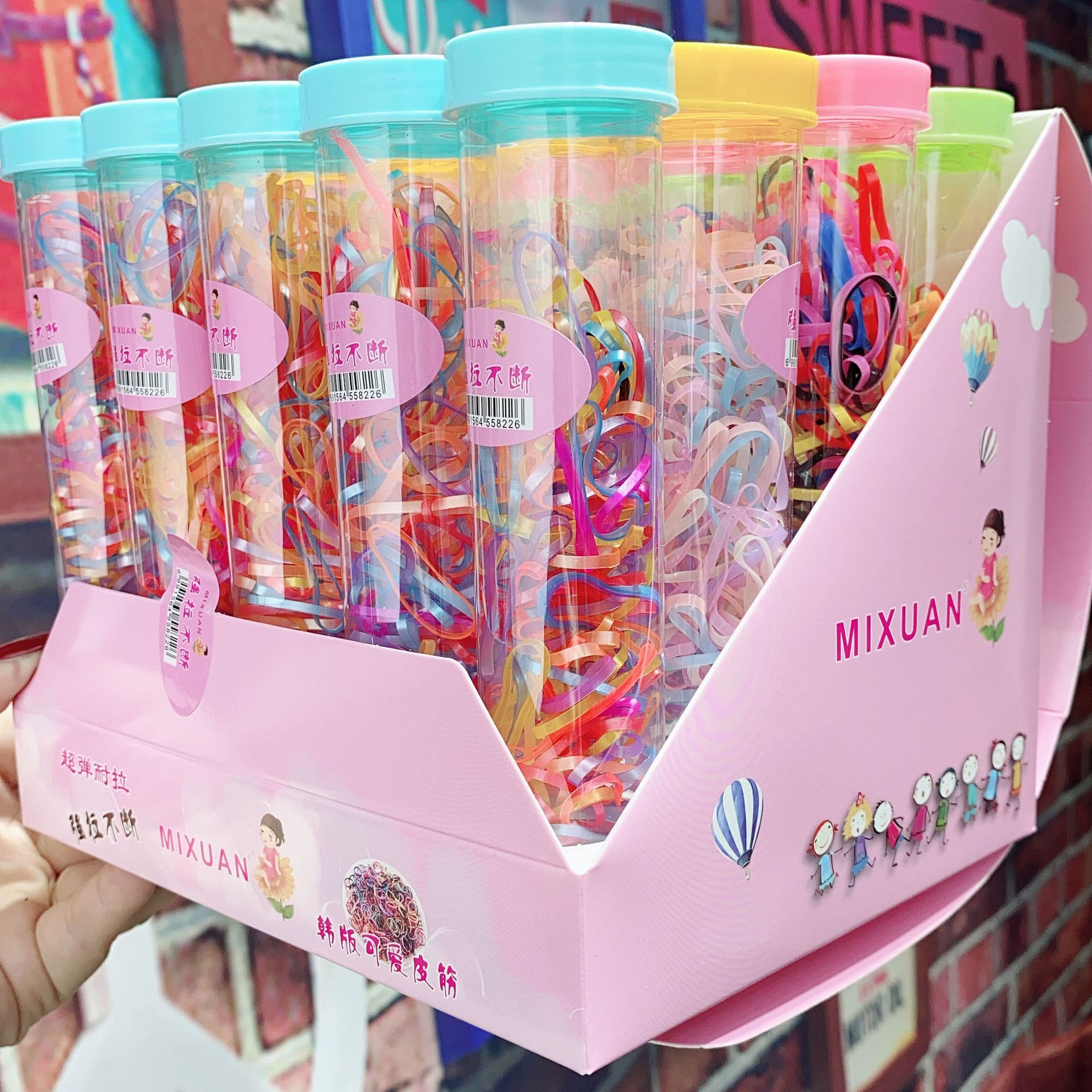 Korean version of children's hair accessories pen box shaped plastic box strong pull continuously disposable baby hair band Application Scenario
