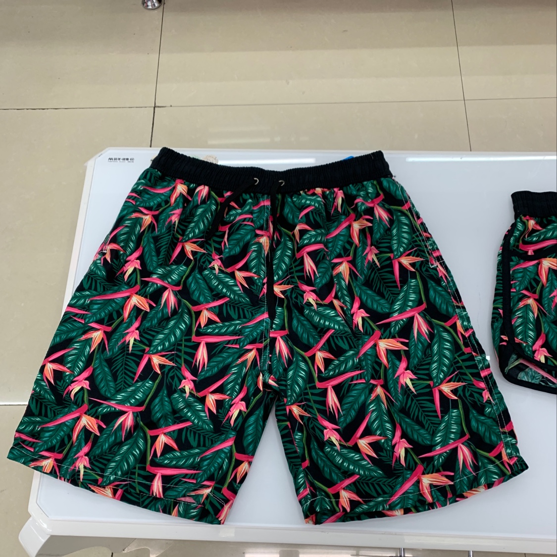Red flower and green leaf couple beach pants