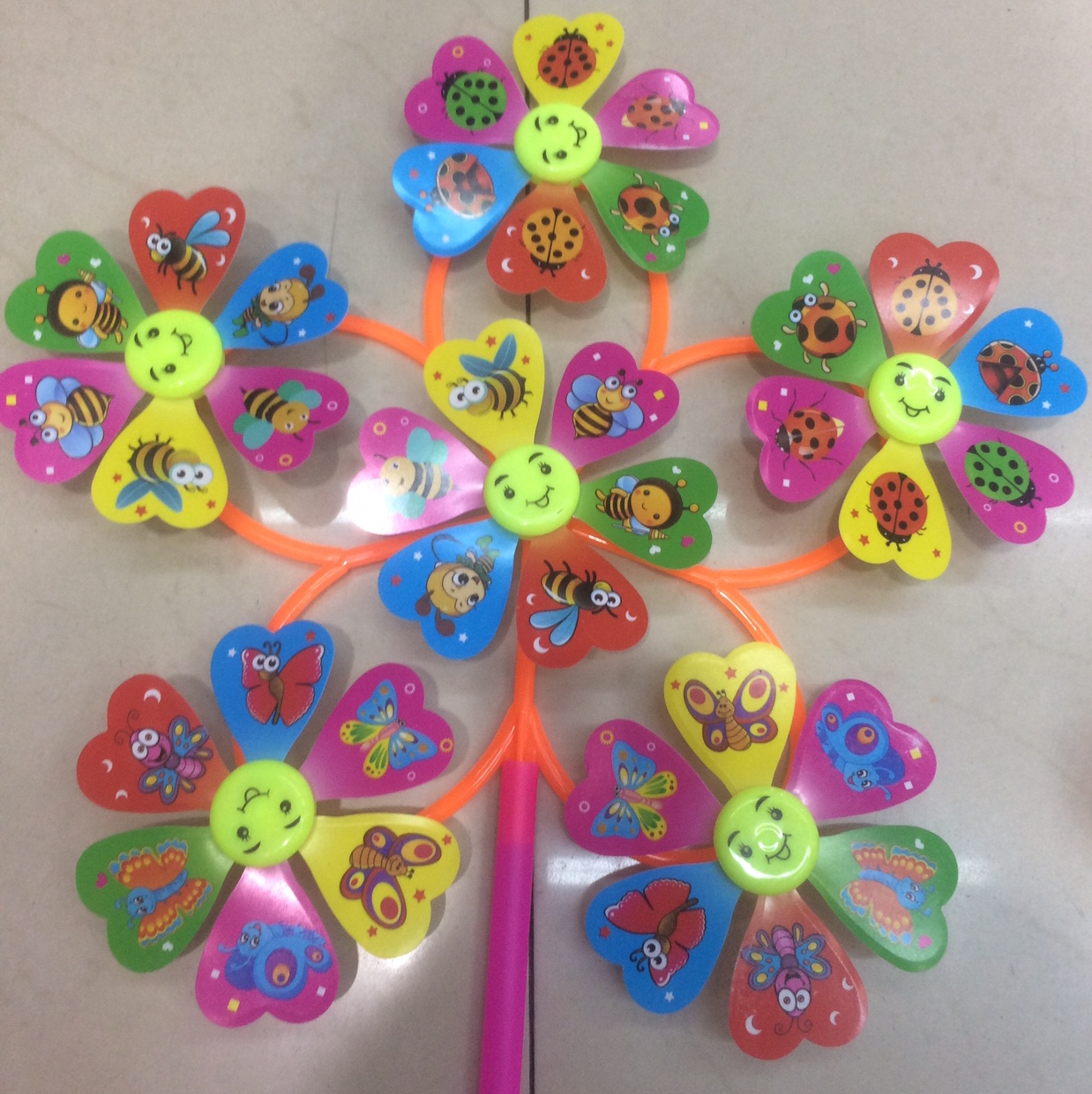 Wholesale of classic and best-selling children's cartoon windmills with Smiling Faces 6-wheel Windmills details Picture