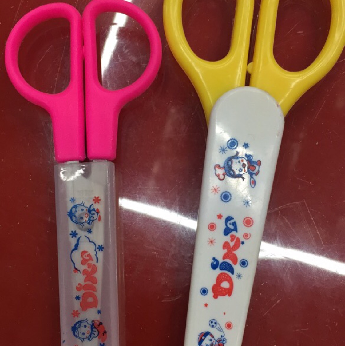 Students with condoms cut with measuring tape scissors