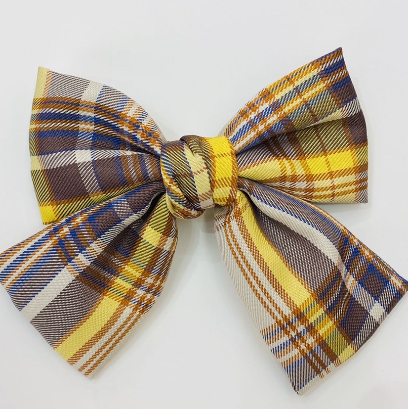 网红新款蝴蝶结弹簧发夹，格子白底实物图