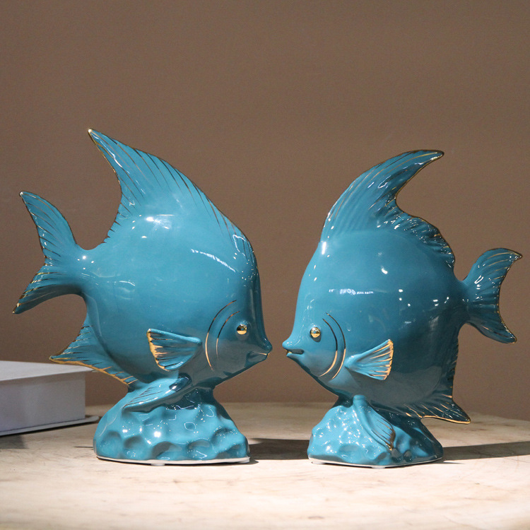 Ceramic fish figurine in dark green with gold plating, a modern home decoration with fish every year, a creative abstract handicraft display