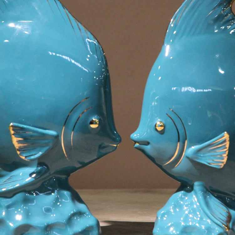 Ceramic fish figurine in dark green with gold plating, a modern home decoration with fish every year, a creative abstract handicraft display Application Scenario