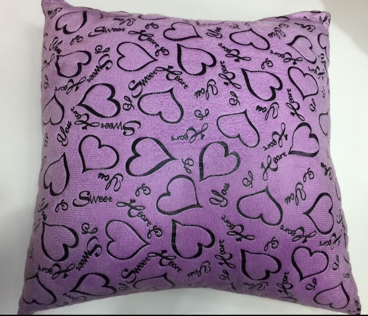 Stylized flat lay of pillow core with plants and books