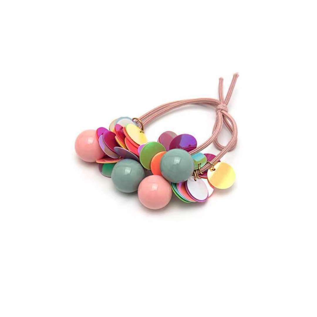 The same style hair tie as Sydney, a popular and cute little round ball sequined hair tie, a girl's bun hairstyle, a rubber band, sequined round beads details Picture