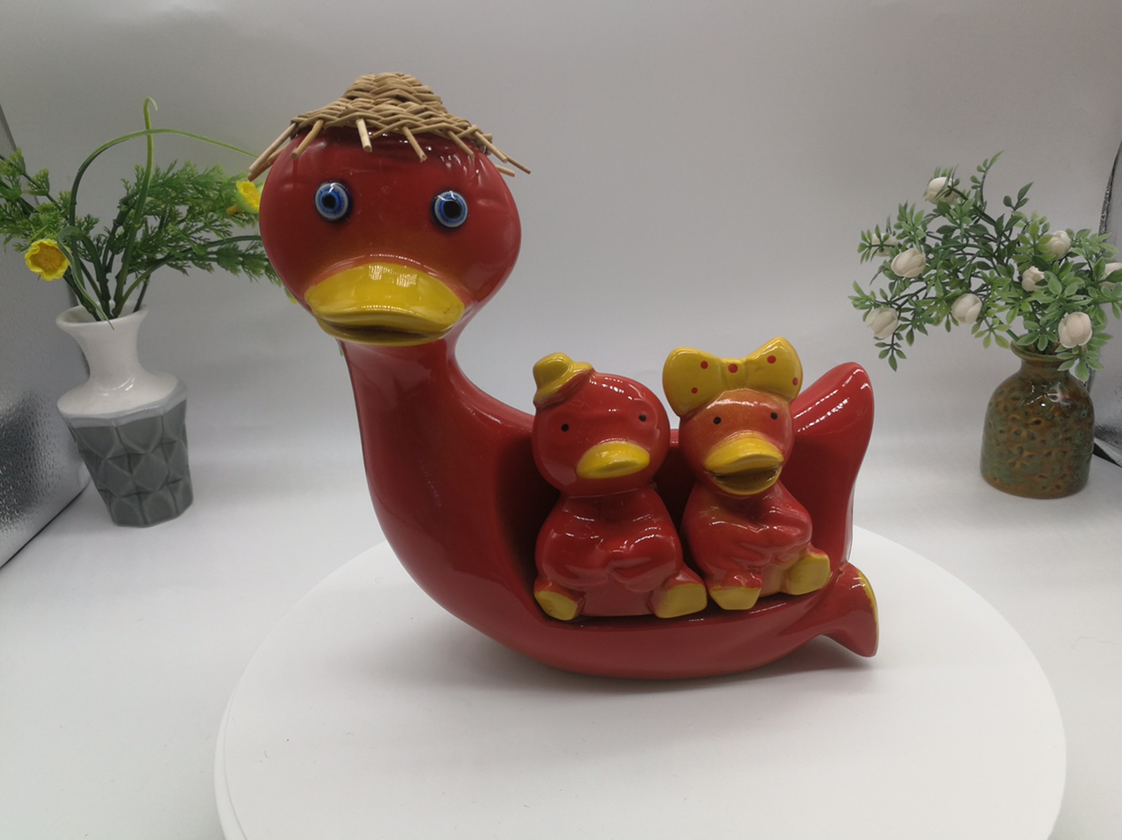 A cute and ugly ceramic duck figurine for a family of three