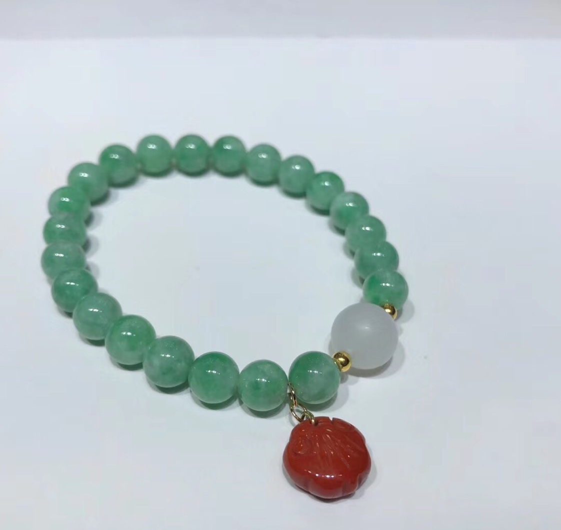 Natural Burmese jade bracelet in light green with 18k gold inlaid in South red